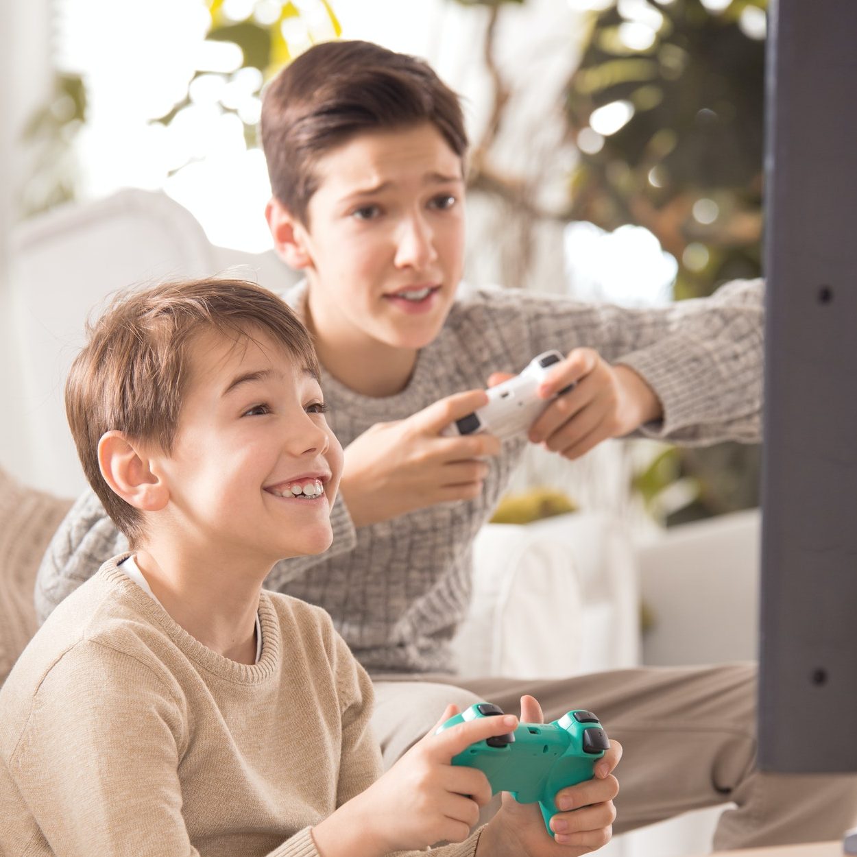 brothers playing on playstation e1615963163461.jpg